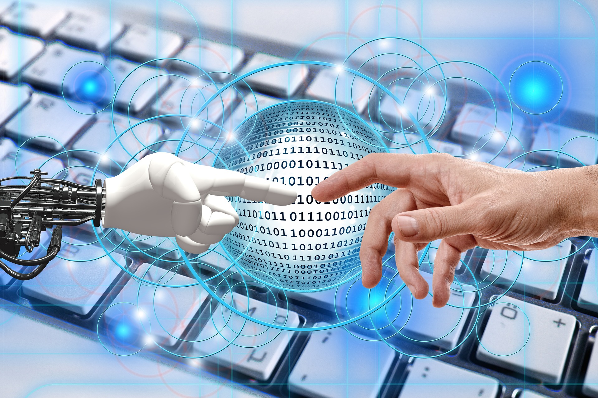 mano de robot y mano humana con fondo de un teclado de ordenador